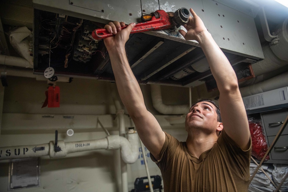 Sailors Conduct Preservation Aboard USS Harpers Ferry