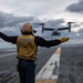 U.S. Sailor guides an MV-22 Osprey, assigned to Marine Medium Tiltrotor Squadron (VMM) 263, as it prepares to land on the flight deck of the aircraft carrier USS John C. Stennis (CVN 74)