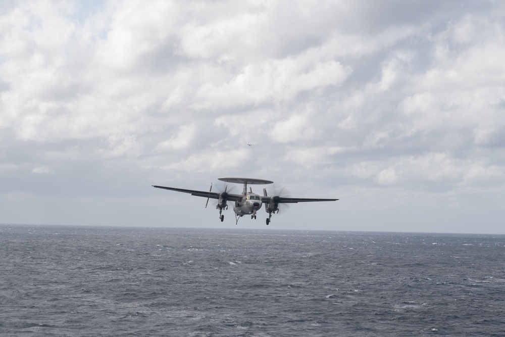 An E-2C Hawkeye prepares to land on the flight deck of the aircraft carrier USS John C. Stennis (CVN 74) in the Atlantic Ocean