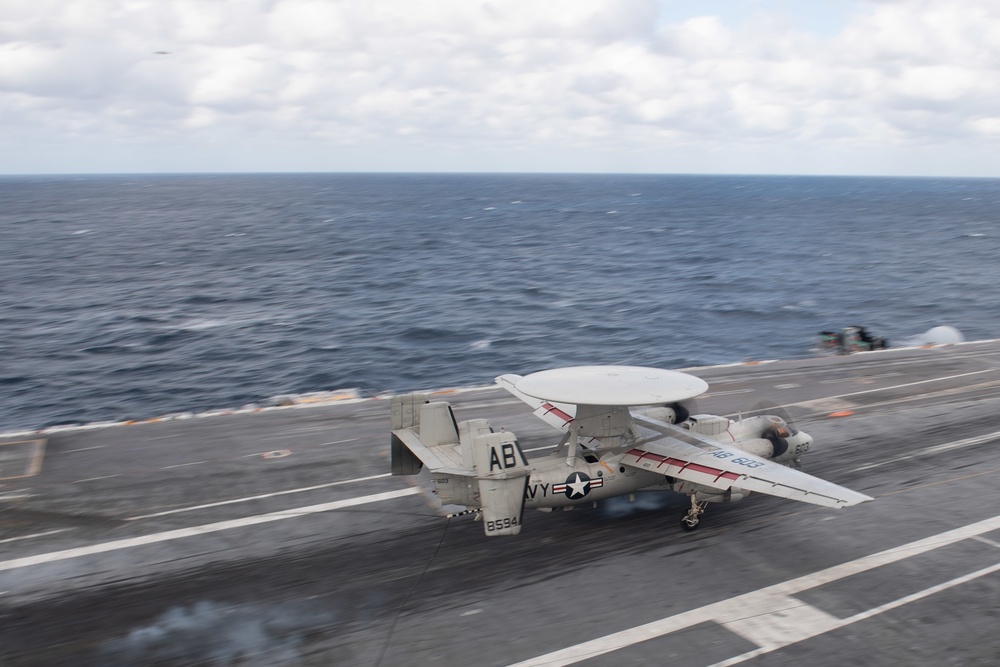 An E-2C Hawkeye, assigned to Carrier Airborne Early Warning Squadron (VAW) 126, lands on the flight deck of the aircraft carrier USS John C. Stennis (CVN 74) in the Atlantic Ocean