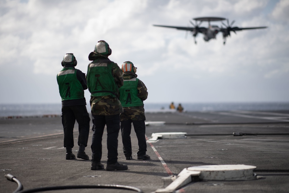 U.S. Sailor man the flight deck