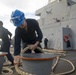 Sailor wraps mooring line around a bollard