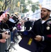 Sailors assigned to Navy Recruiting District New York pass out Navy-themed gifts