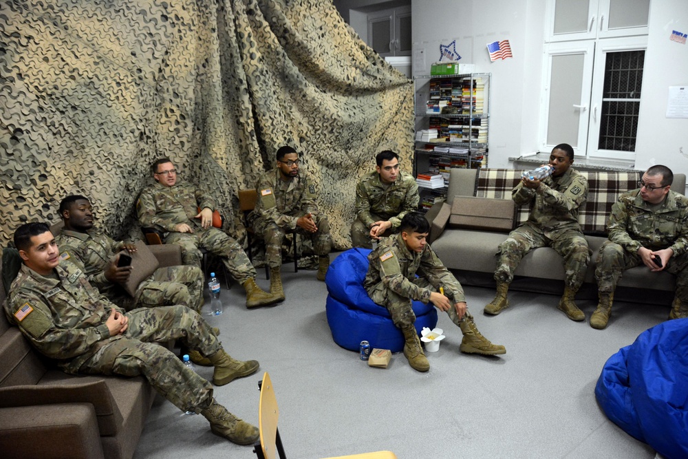 40th Expeditionary Signal Battalion Soldiers participate in football watch party