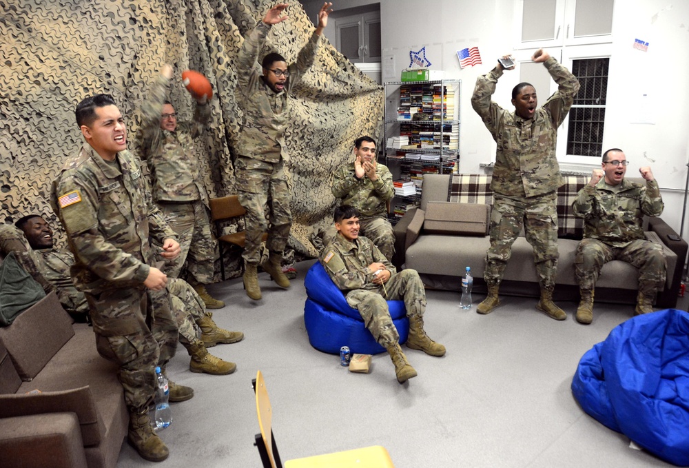 40th Expeditionary Signal Battalion Soldiers participate in football watch party