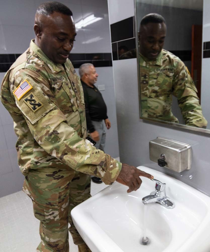 Command Sgt. Maj Maynard inspects faucet in Puerto Nuevo, Puerto Rico