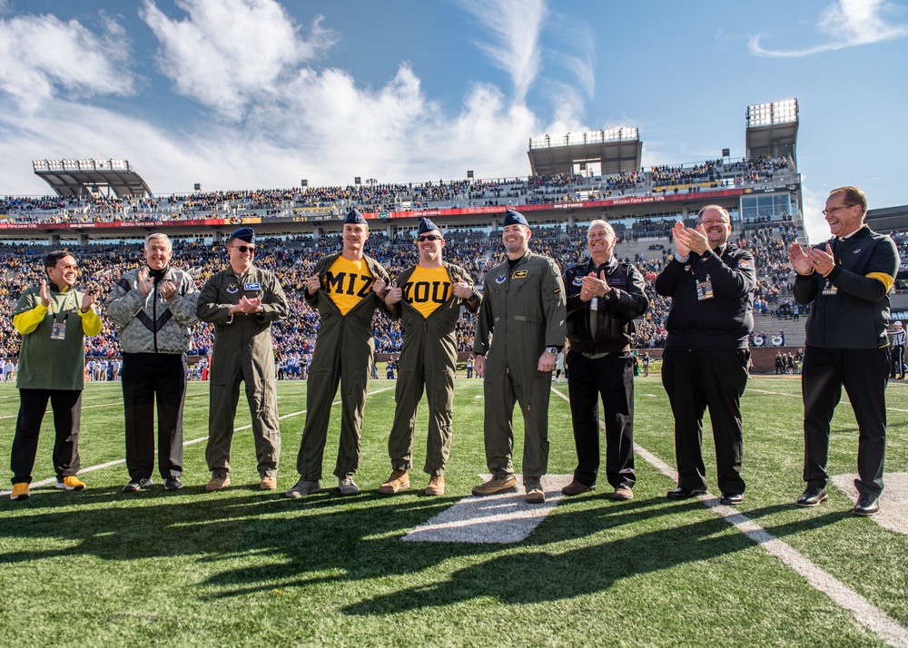 Pilots from Whiteman Air Force Base wave to the crowd during the University of Missouri military appreciation game