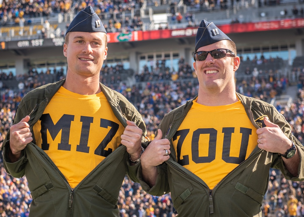 Pilots from Whiteman Air Force Base reveal their Mizzou shirts during the University of Missouri military appreciation game