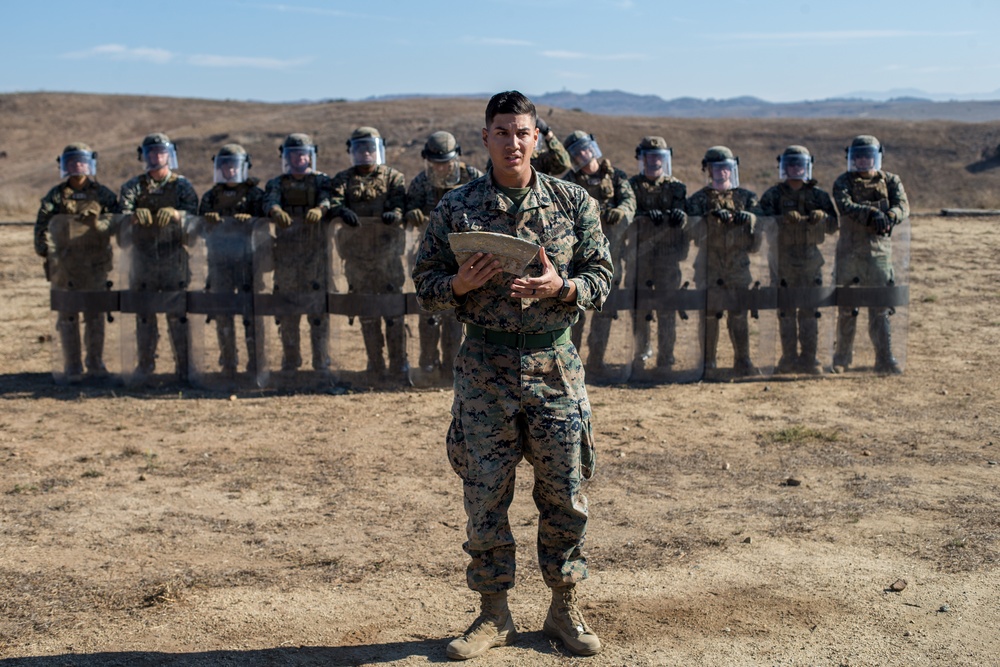 U.S. Marines with 1st LE Bn. familiarize themselves with non-lethal weapons