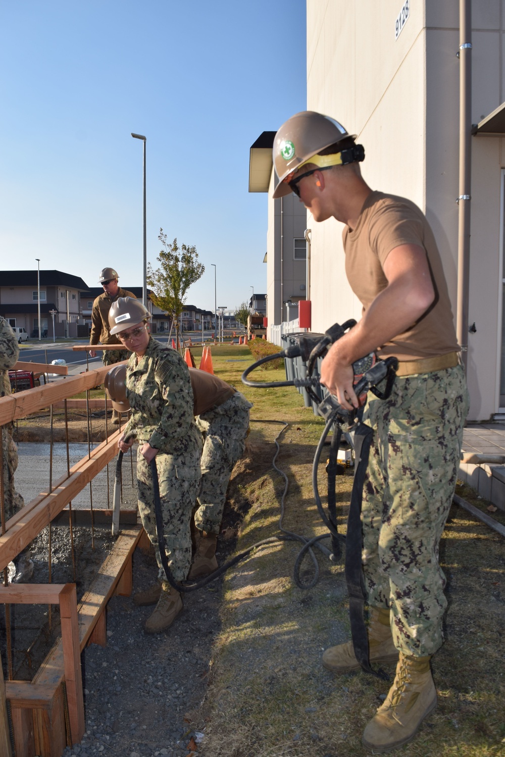 U.S. Navy Seabees deployed with Naval Mobile Construction Battalion 5’s Detail Iwakuni prepare for concrete placement