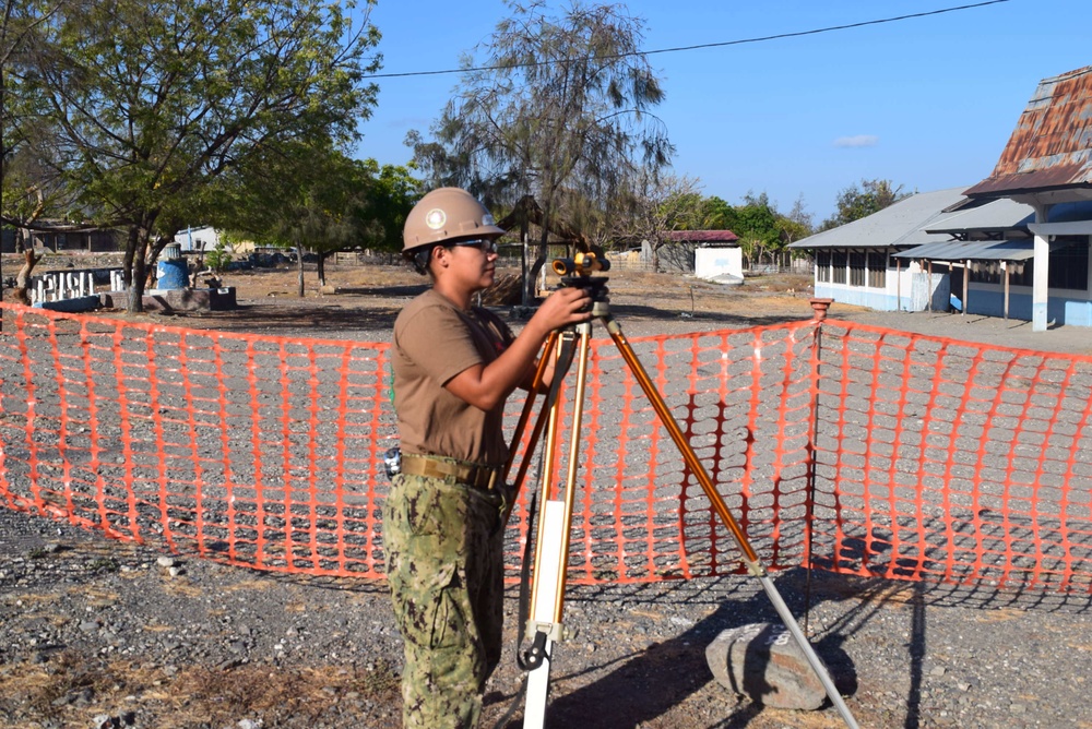 U.S. Navy Seabees deployed with Naval Mobile Construction Battalion 5's Detail Timor-Leste prepare for construction on an education center