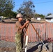 U.S. Navy Seabees deployed with Naval Mobile Construction Battalion 5's Detail Timor-Leste prepare for construction on an education center