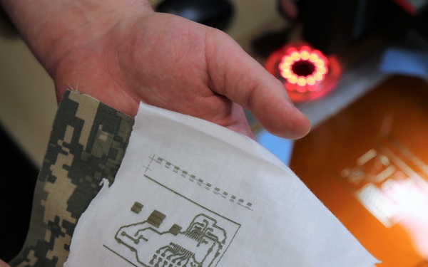 Ink jet-printed circuits will be placed between layers of a uniform allowing the LEDs to safely activate if a warfighter suspects an agent threat.
