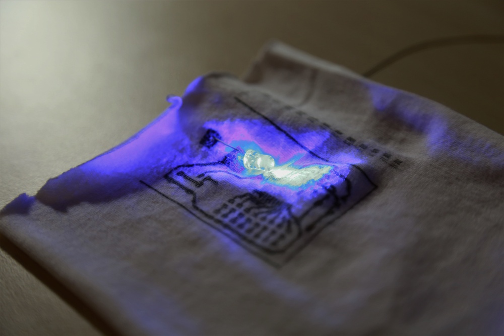 Conductive, flexible, silver ink circuitry printed on fabric will allow LEDs to be embedded within uniforms.