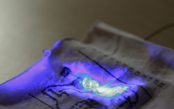 Conductive, flexible, silver ink circuitry printed on fabric will allow LEDs to be embedded within uniforms.
