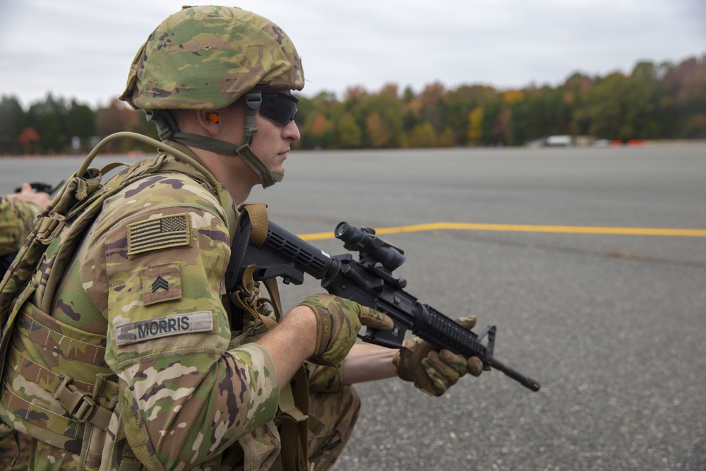 U.S. Army Soldier Awaits U.S. Marine Corps MV-22B Osprey During Combined Unit Exercise