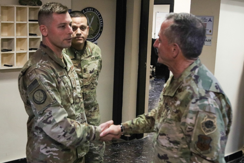 Air Force Chief of Staff General David Goldfein present coins of excellence to deployed troops in Iraq