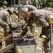 U.S. Navy Seabees deployed with NMCB-5’s Detail Palawan and Seabees from the Armed Forces of the Philippines 2nd NMCB place concrete