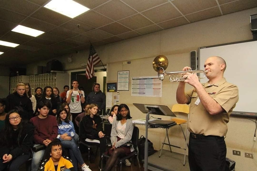 U.S. Naval Forces Europe Band’s MU1 David Koelz leads a masterclass for students at Naval Support Site’s High School.