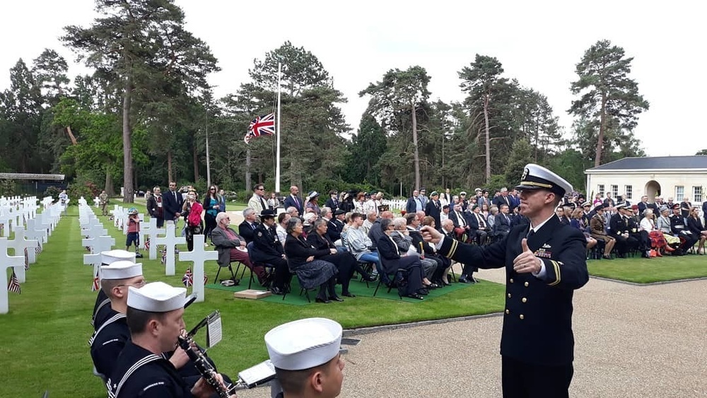 Lieutenant Junior Grade Matthew Anderson conducts the ceremonial band at Brookwood American Battle Monuments Cemetery.