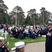 Lieutenant Junior Grade Matthew Anderson conducts the ceremonial band at Brookwood American Battle Monuments Cemetery.