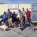 USS Normandy Sailors Pose For Photograph Volunteering At Animal Shelter