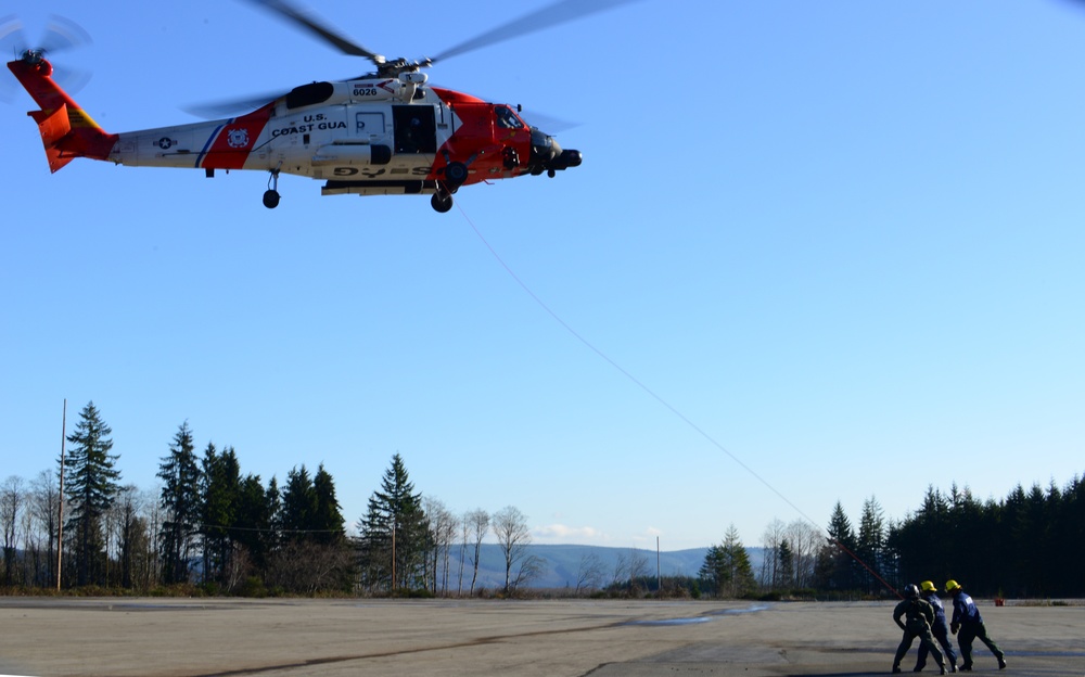 Coast Guard aircrew trains with Clatskanie Fire and Rescue