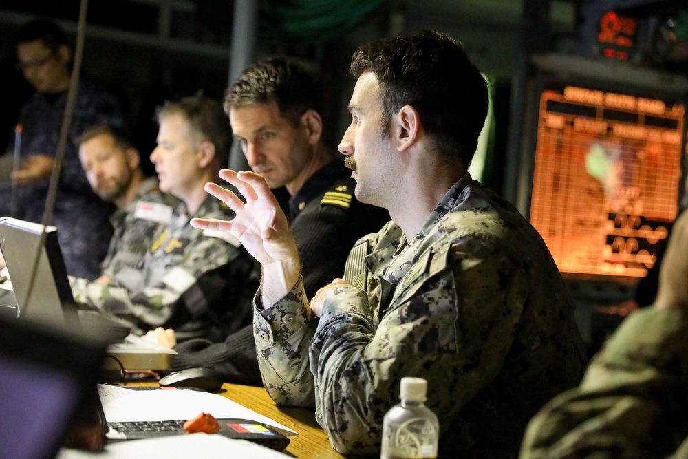 An operational debrief is held for Mine Warfare Exercise 3JA 2019