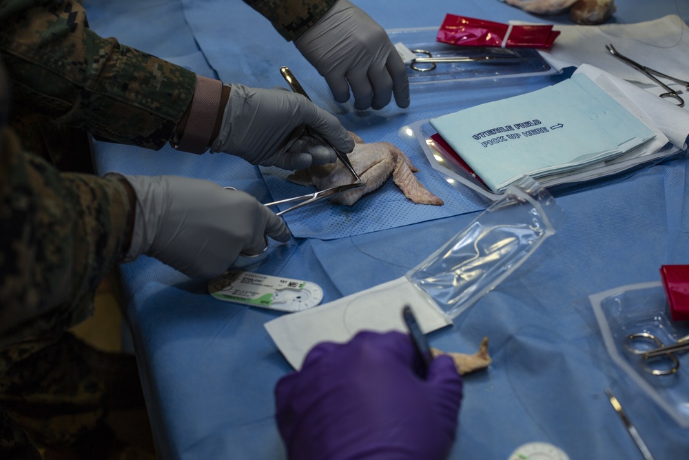 U.S. Navy Sailors Conduct Suturing Practical Application