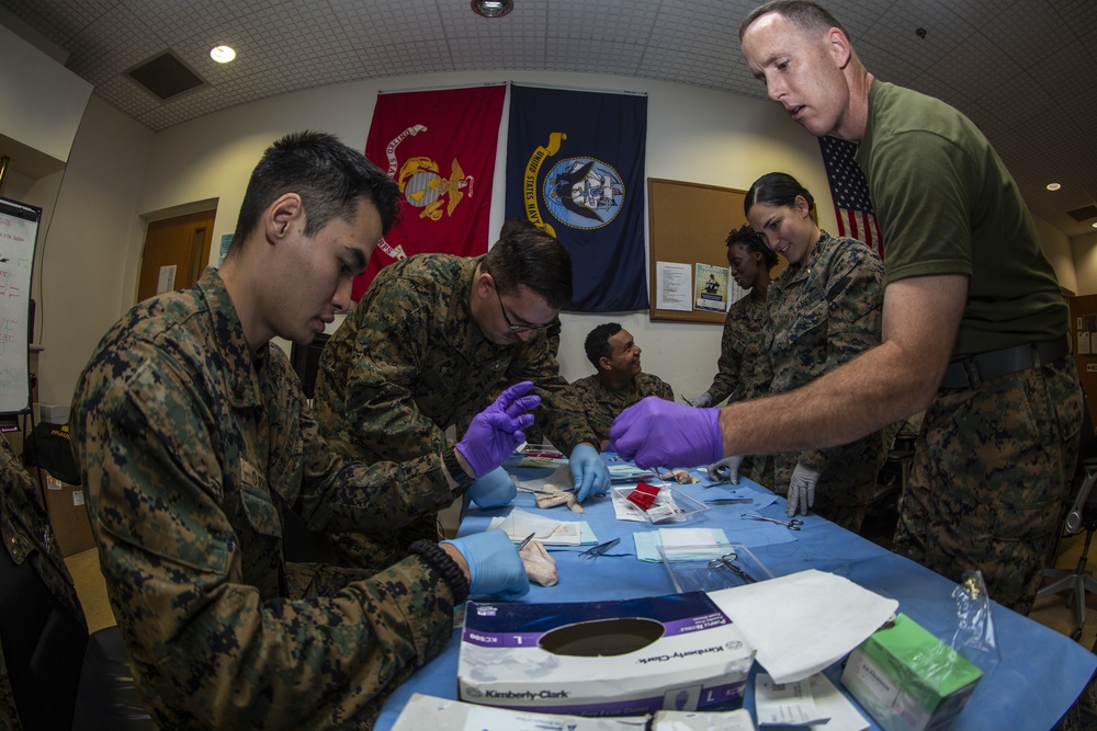 U.S. Navy Sailors Conduct Suturing Practical Application