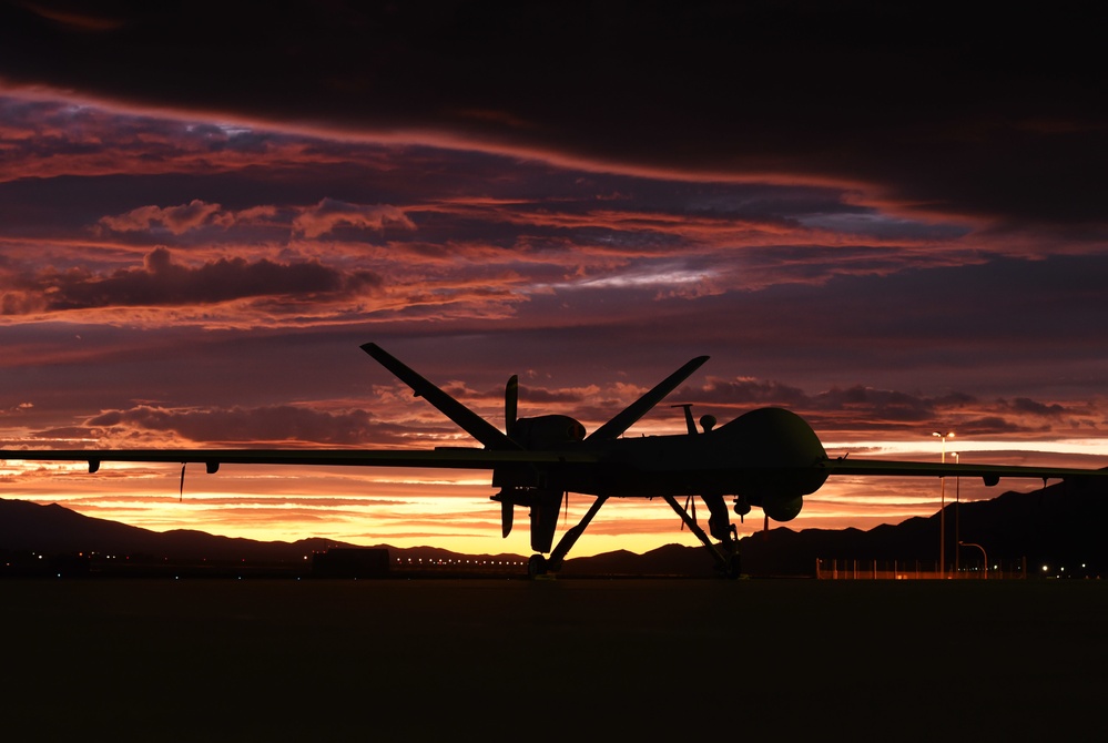 MQ-9 Reaper and aircrew underneath Nevada sunset