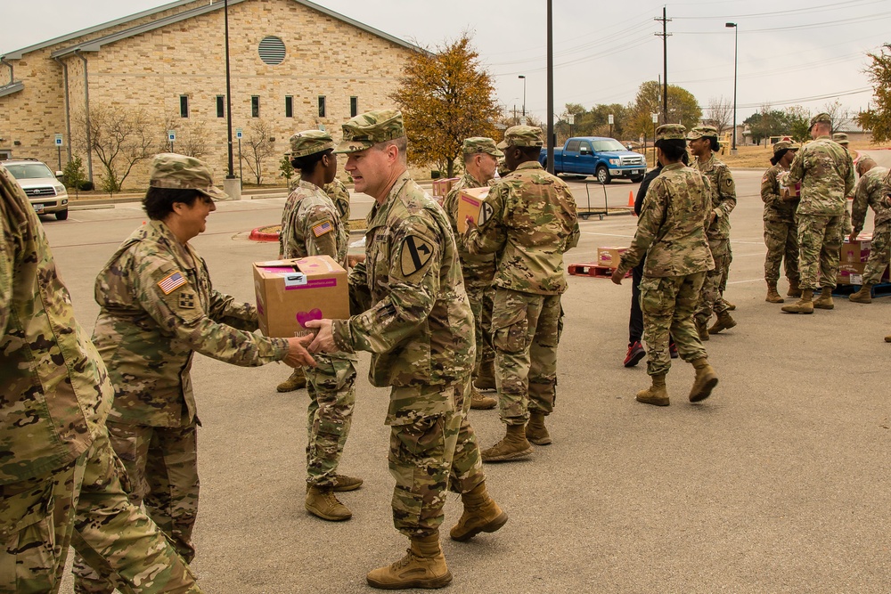 Chaplains and religious affairs specialist from Fort Hood units sort and organize holiday food baskets to be distributed to military families on Nov. 20 at Fort Hood’s Main Post Chapel.