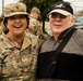 Chaplain Maj. Lisa Northway, 1st Calvary Sustainment Brigade, smiles for a picture with a volunteer from the Onion Creek community who came to assist with distributing Thanksgiving turkey baskets on Nov. 20 at Fort Hood's Main Post Chapel.