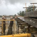 U.S. Navy Seabees deployed with NMCB-5’s Detail Tinian continue work on Explosive Ordnance Disposal Mobile Unit 5’s Boat Storage Facility