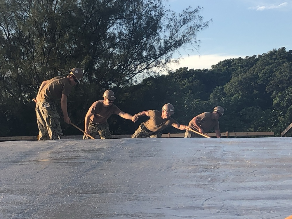 U.S. Navy Seabees deployed with NMCB-5’s Detail Tinian continue work on Explosive Ordnance Disposal Mobile Unit 5’s Boat Storage Facility