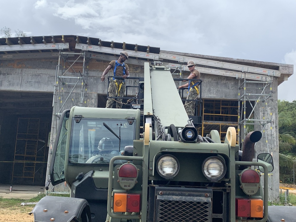 U.S. Navy Seabees deployed with NMCB-5’s Detail Tinian continue work on Explosive Ordnance Disposal Mobile Unit 5’s Boat Storage Facility