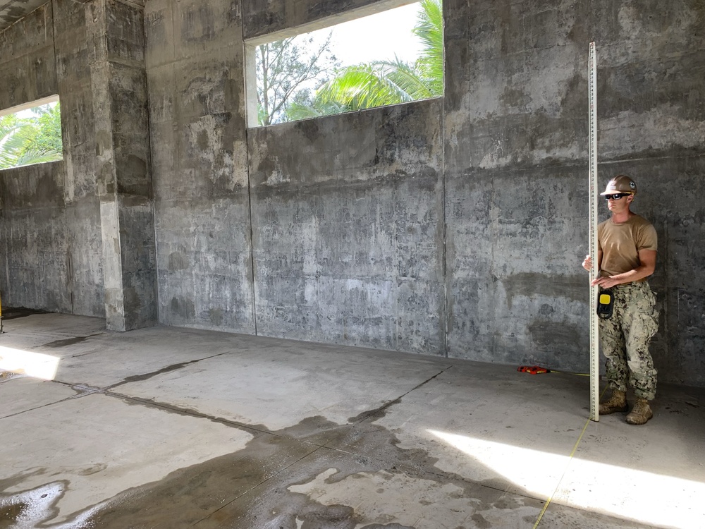 U.S. Navy Seabees deployed with NMCB-5’s Detail Tinian continue work on Explosive Ordnance Disposal Mobile Unit 5’s Boat Storage Facility