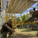 U.S. Navy Seabees deployed with NMCB-5’s Detail Tinian continue work on Explosive Ordnance Disposal Mobile Unit 5’s Boat Storage Facility