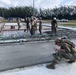 U.S. Navy Seabees from NMCB 5’s Detail Diego Garcia place concrete in support of the U.S. Air Force