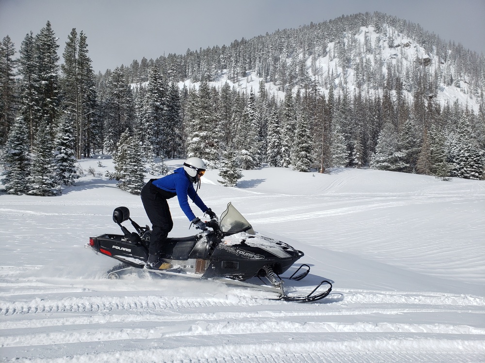 Airmen ride snowmobiles at Monarch mountain