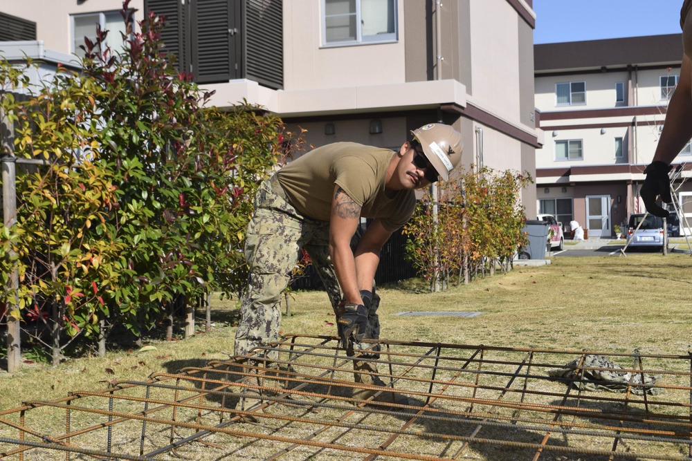 U.S. Navy Seabees deployed with NMCB-5’s Detail Iwakuni continue construction on environmental enclosures