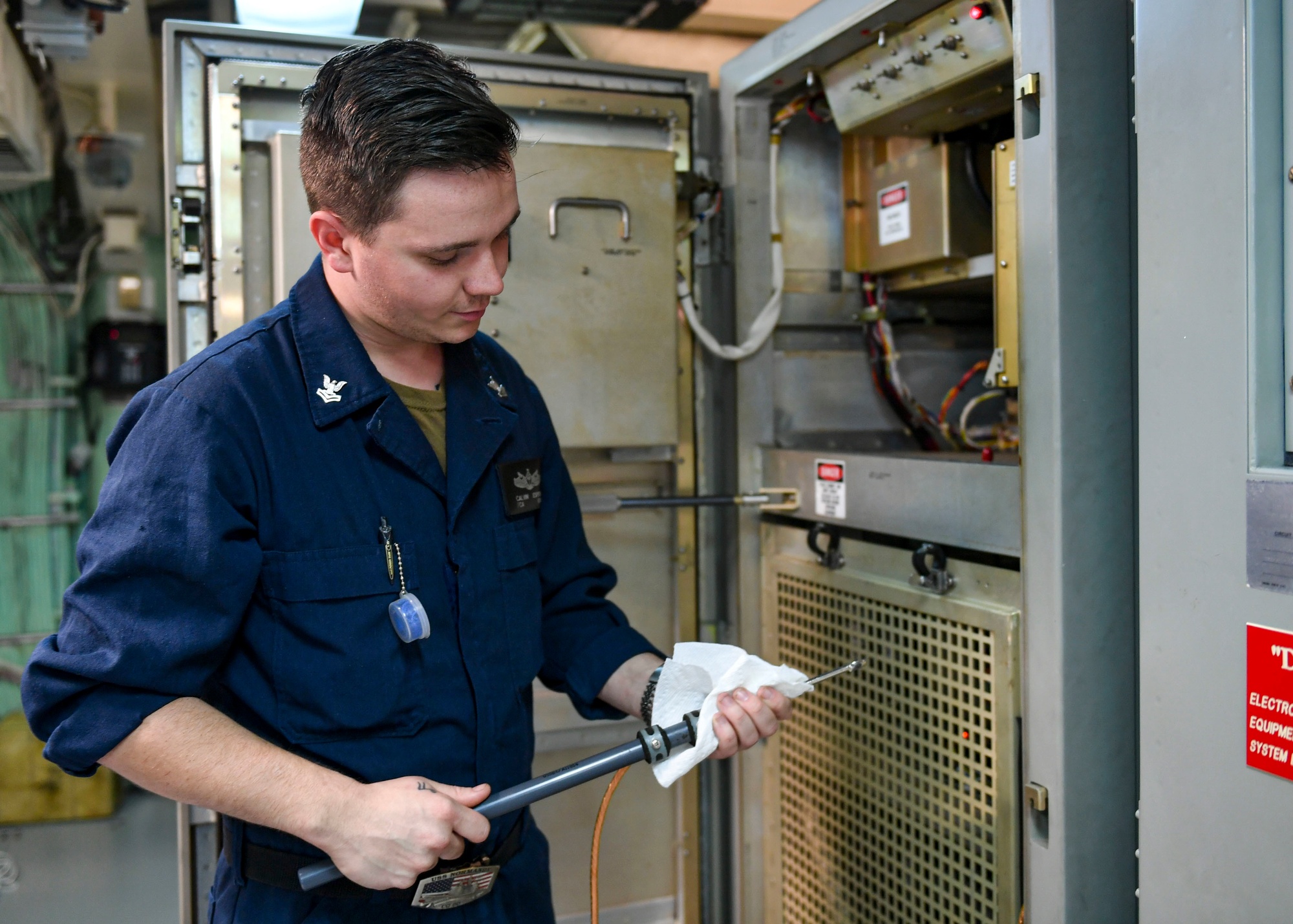 DVIDS - Images - USS Normandy Sailor Cleans Shorting Probe [Image 4 of 4]