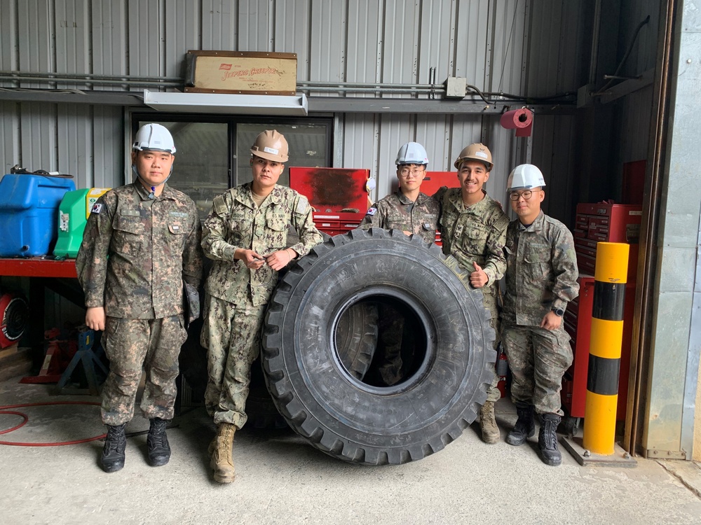Naval Mobile Construction Battalion 5’s Detail Chinhae work with members of Republic of Korea