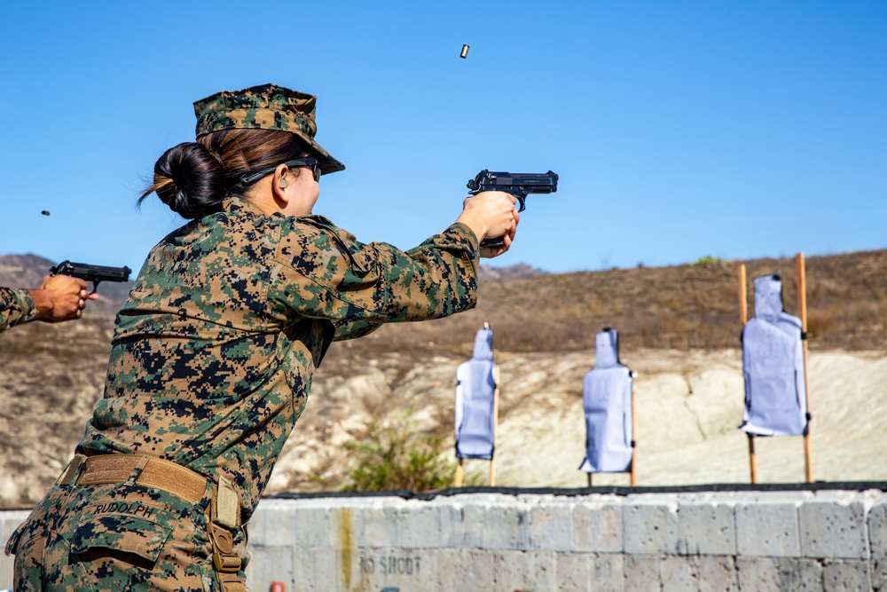 Marines and Sailors with the 13th MEU CE refine their combat marksmanship skills with their M9 pistols during a pistol qualification as part of annual training.