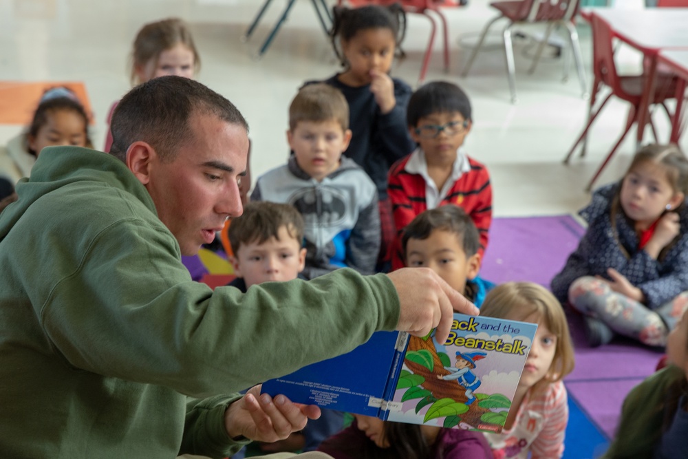U.S. Marines and Sailors read and interact with elementary school students during Fuji Viper 20-2