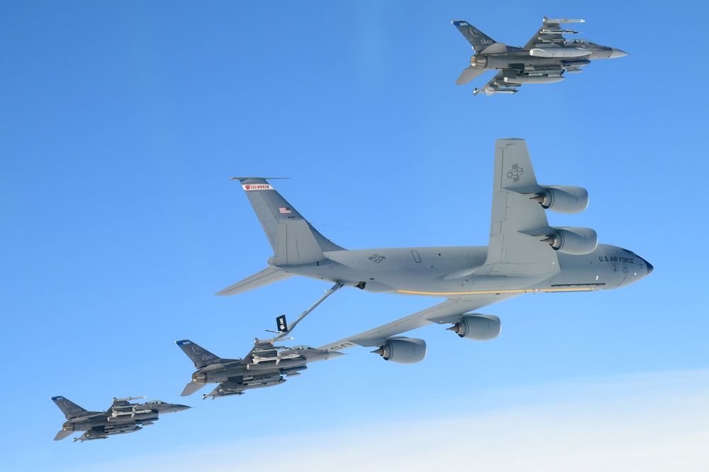 F-16 Fighting Falcons and a KC-135 Stratotanker Perform Refueling Mission