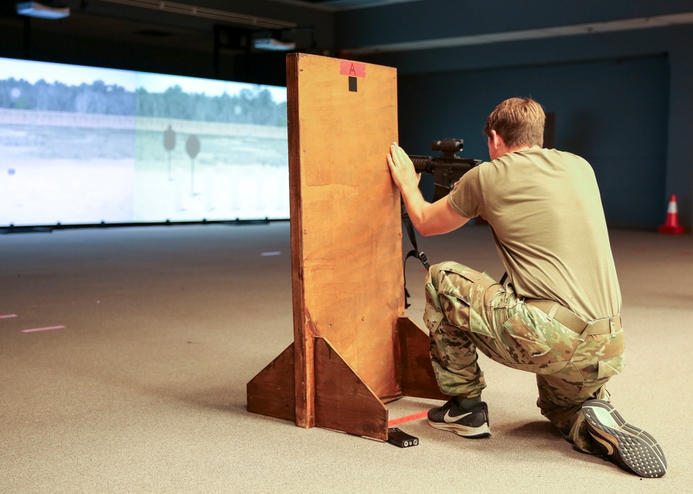 USAJFKSWCS Student uses virtual simulations through Squad Advanced Marksmanship Trainer