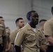 U.S. Sailors stand in ranks during a frocking ceremony in the hangar bay aboard the aircraft carrier USS John C. Stennis