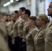 U.S. Sailors stand in ranks during a frocking ceremony in the hangar bay aboard the aircraft carrier USS John C. Stennis