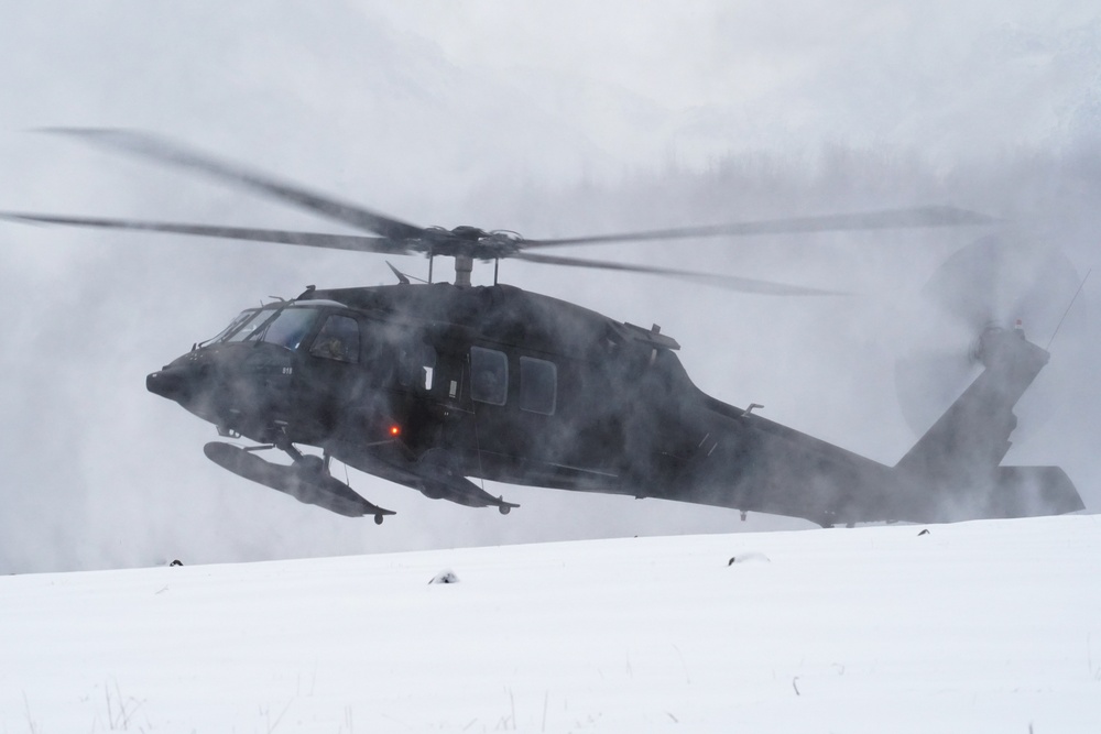 A UH-60 Black Hawk helicopter, and Alaska Army National Guard aviators land on Neibhur Drop Zone, Nov. 26, 2019. 